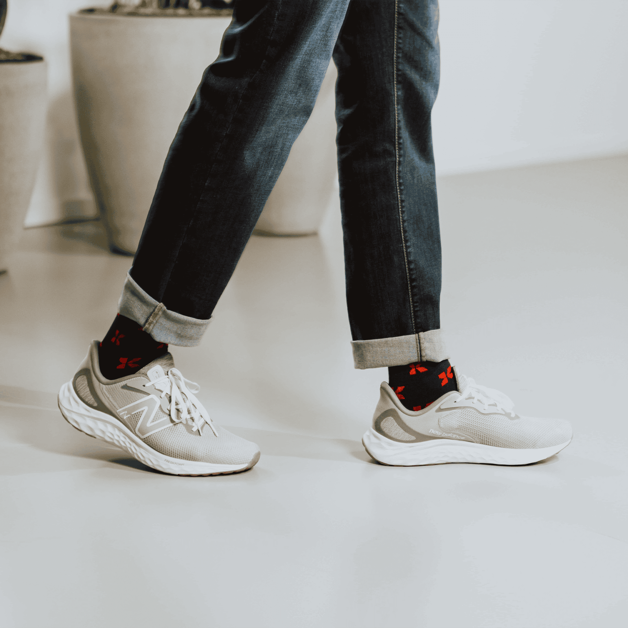 purple socks branded with kalmar logo on model